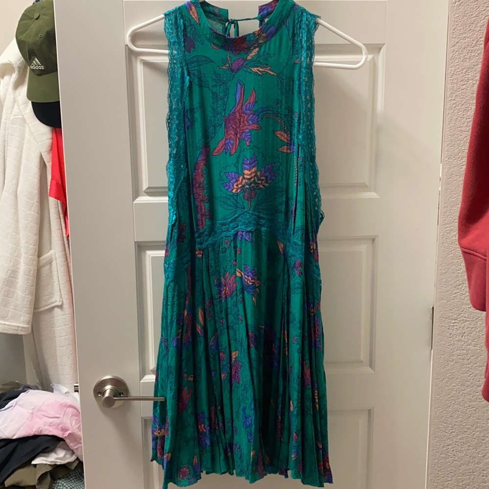 Printed mini shift dress with lace details and deep open back.